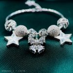 vòng tay nữ charm nơ chuông phối ngôi sao